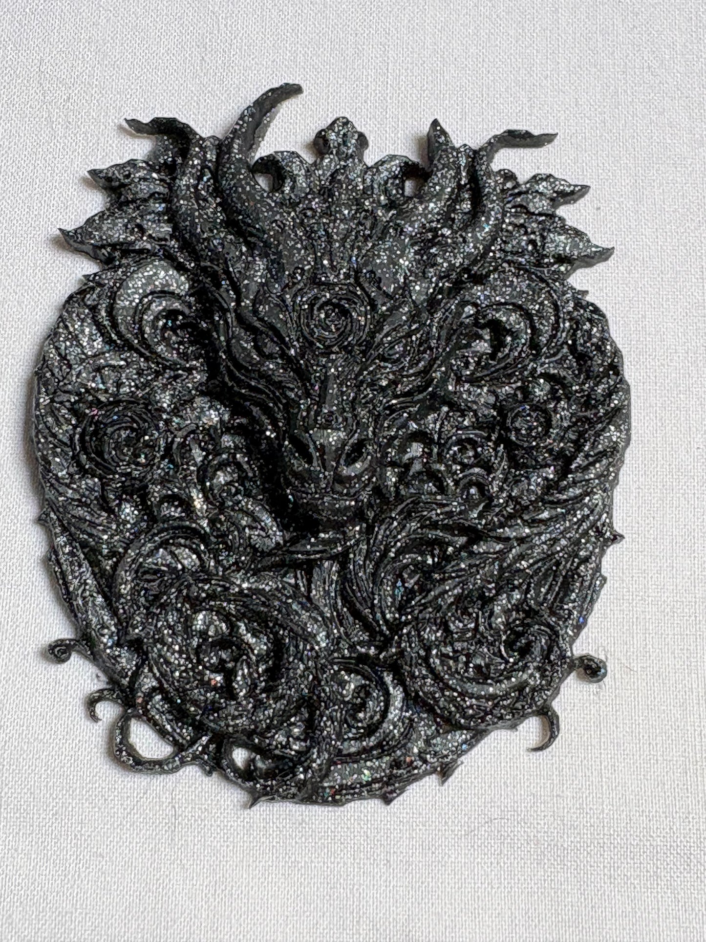 black-grey dragon, amulet
