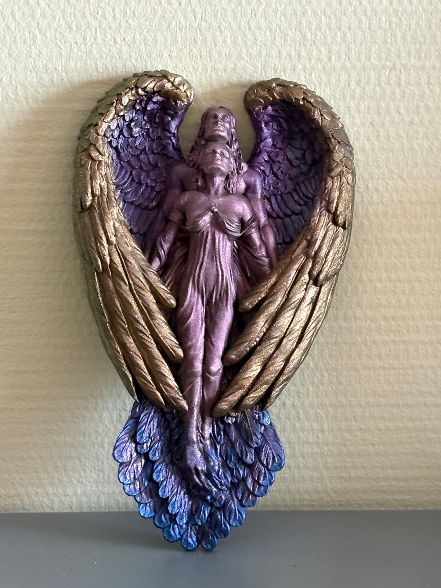 Gevleugeld koppel amulet