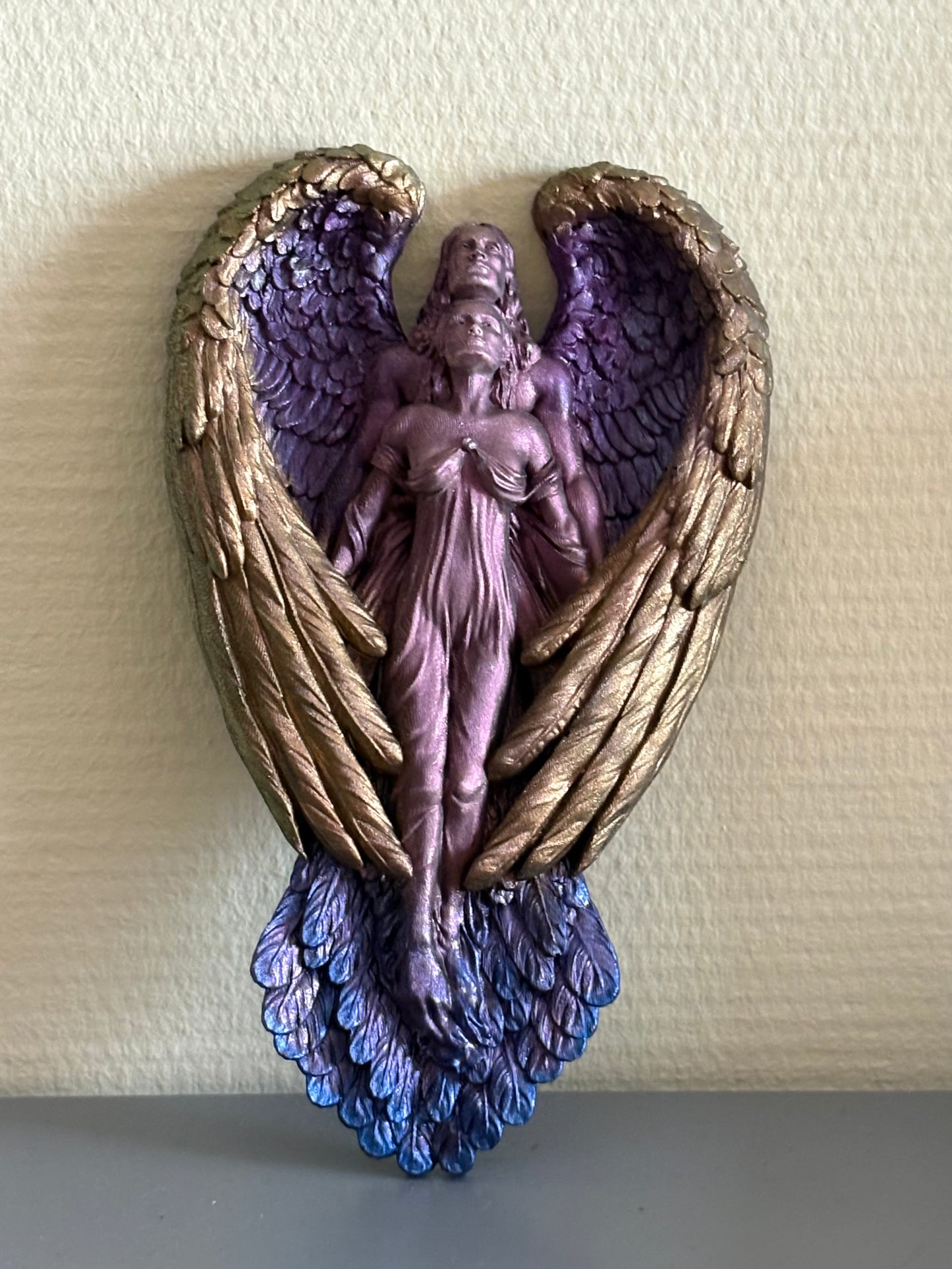 Gevleugeld koppel amulet